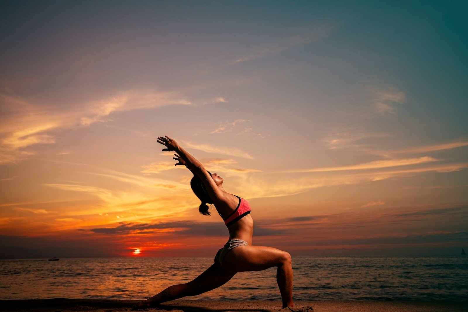 A person in a lunge against the sunrise